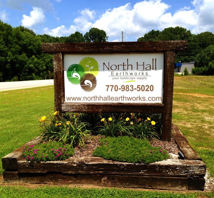 North Hall Earthworks advertisement on a board